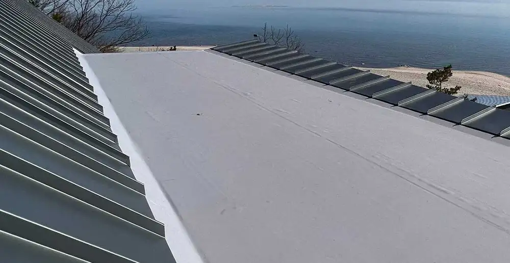 Roofing crew installing underlayment
